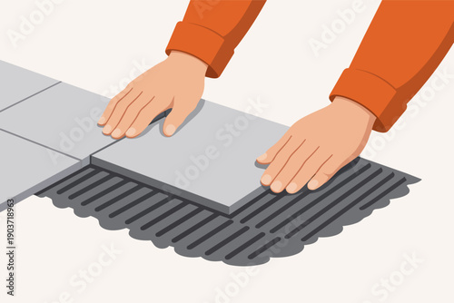 Worker hands installing floor tiles during home renovation project