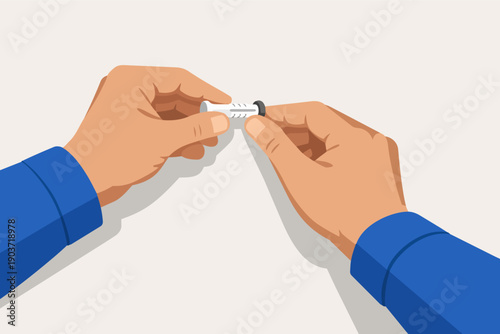 Hands holding a wall plug for mounting objects and home improvement