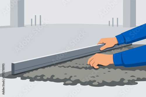 Worker hands leveling concrete floor with screed bar for construction project