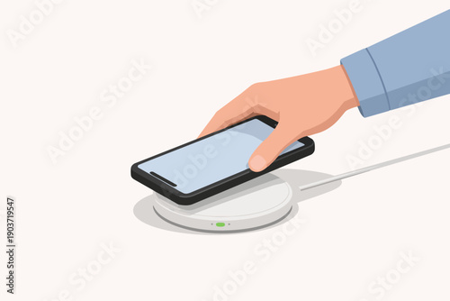 Hand placing smartphone on wireless charging pad illustrating modern technology