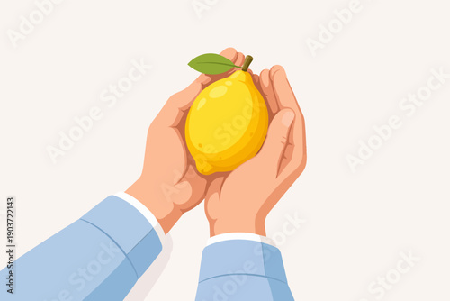 Hands holding fresh yellow lemon, representing organic farming and healthy eating
