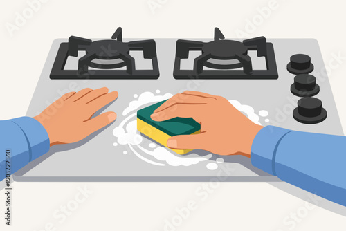 Person cleaning kitchen stove with sponge and soapy water, doing housework chores