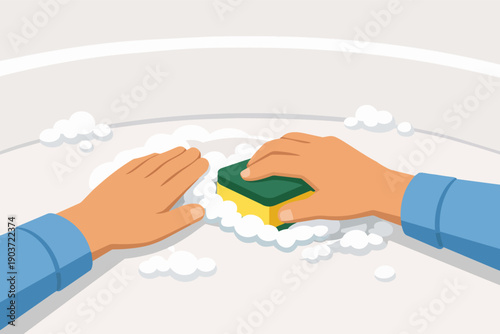 Hands cleaning surface with sponge and suds, performing household chores and hygiene