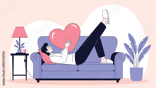 Man lying on a purple sofa while hugging a large pink heart shaped pillow in a cozy living room with a lamp and plants.