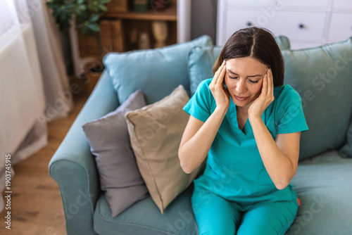 Frustrated woman, nurse and headache with stress for mistake, failure or overworked in home. Tired, female person or caregiver with migraine, fatigue or flare for burnout, mental health or depression.
