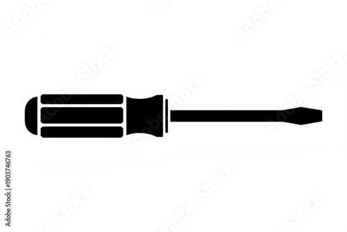 Essential Precision: A sleek, black silhouette of a screwdriver, a symbol of craftsmanship and precision, lies against a minimalist background. 