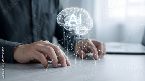 A close up shot of a persons hands resting on a light colored desk while interacting with a glowing futuristic artificial intelligence brain visualiza