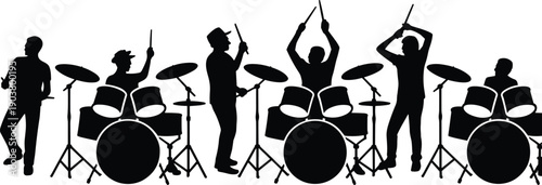 Silhouette of a rock band drummer ensemble performing on stage with multiple drum kits and musicians playing energetically