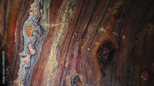 Rainbow Cave on Hormuz Island, Iran, showcasing naturally colorful rock formations and mineral layers. Unique geological landscape, natural wonder, travel destination, earth textures, vibrant colors, 