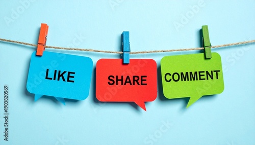 Speech bubble cards with “LIKE,” “SHARE,” “COMMENT” on string