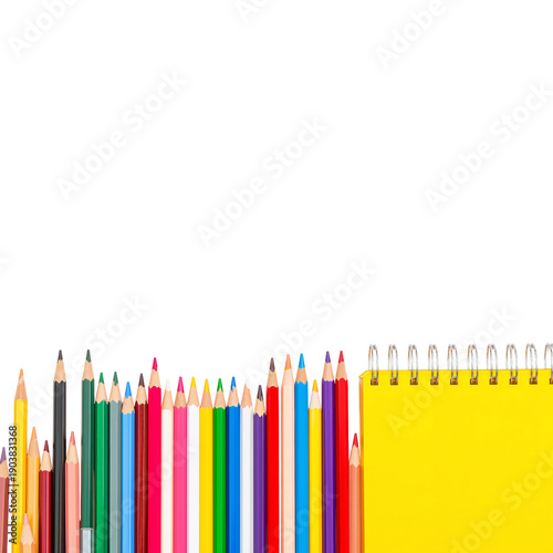 Colorful Pencils and Notepad for Drawing Setup on a White Background in a Cre...