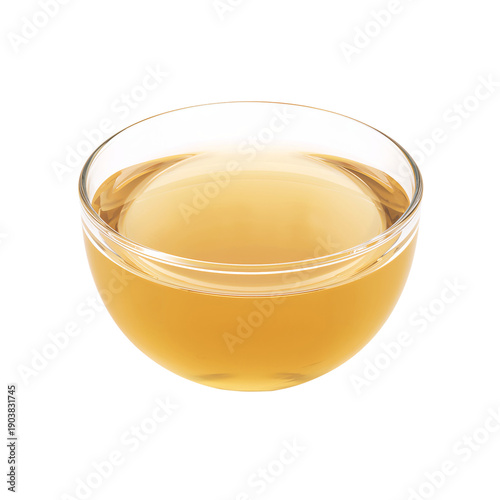 Warm Liquid in a Clear Bowl Sitting on a Plain White Surface in Bright Room
