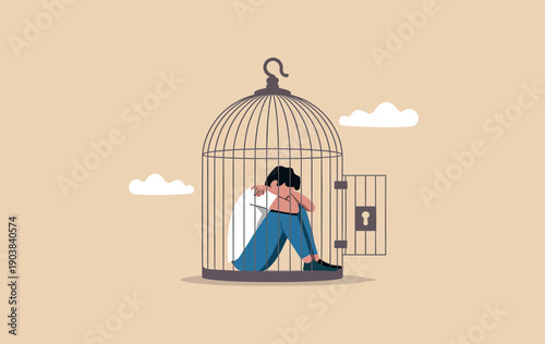 Depressed man sitting inside an open birdcage symbolizing mental health issues and self-imposed isolation