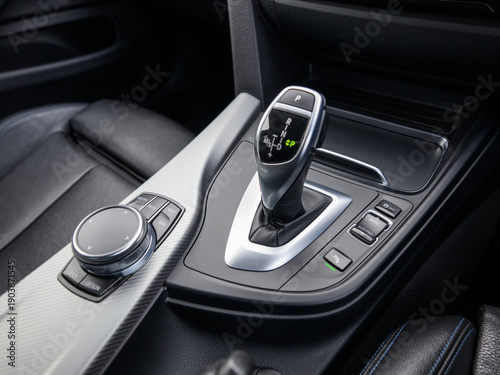 Automatic gear selector shifter on car center console close up