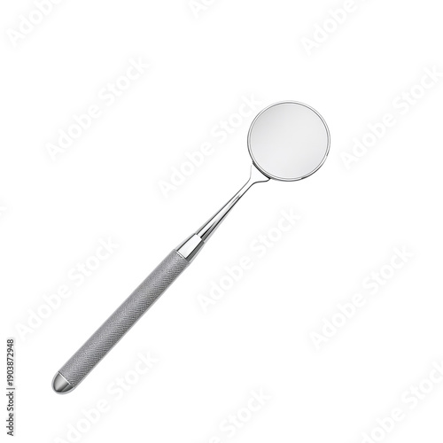 Spoon With a Shiny Surface and Textured Handle Placed on a Plain Background