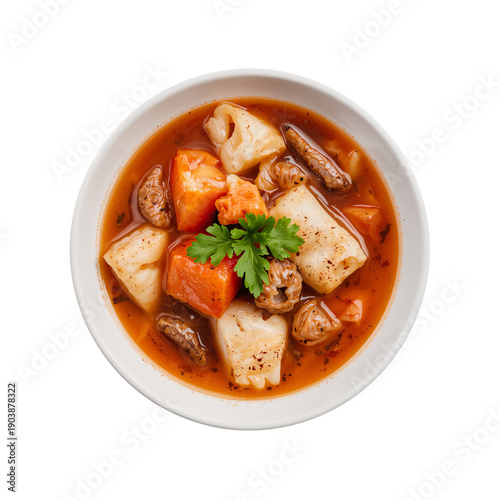 Warm Soup With Fish and Dumplings Served in a White Bowl at a Kitchen Table D...