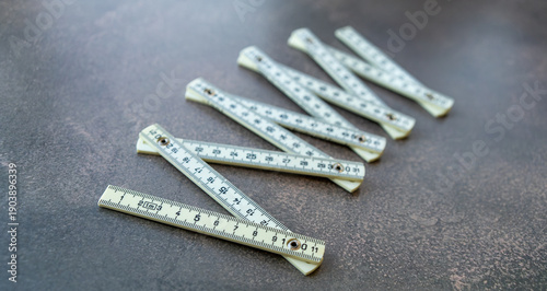 Photos Folding measuring ruler on a gray background