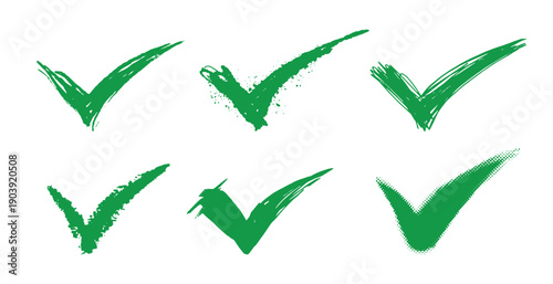Set of green grunge Check marks, tick, yes, vote brush made symbols or icons. Agree or approving emblem. Hand drawn bold strokes.