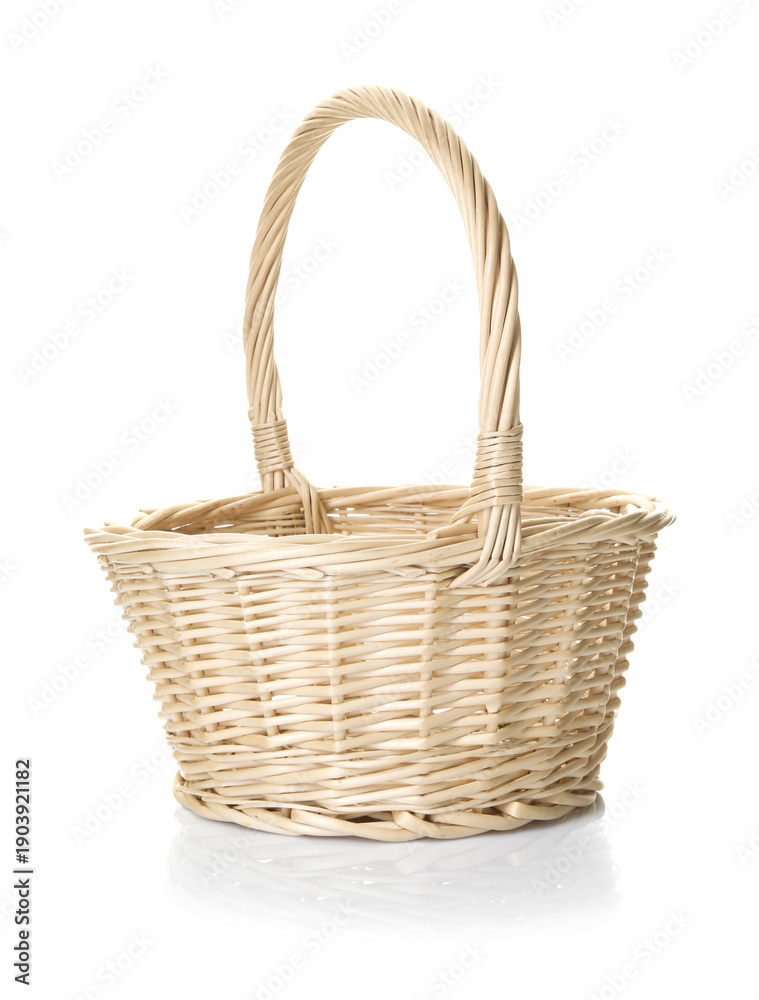 Obraz premium One empty wicker basket isolated on white