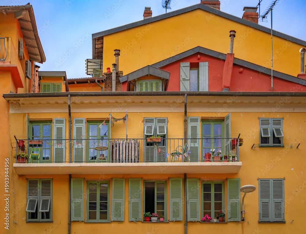 Obraz premium Mediterranean houses in terracotta colors with traditional shutters, Nice France
