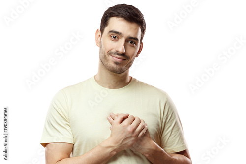 Foto Kind hearted friendly nice guy shows kindness, wearing blank biege t-shirt