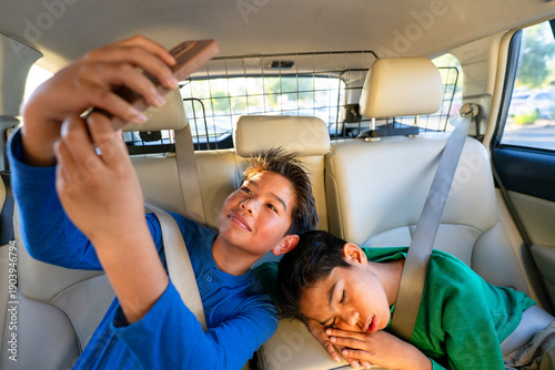 kids riding backseat road trip fun