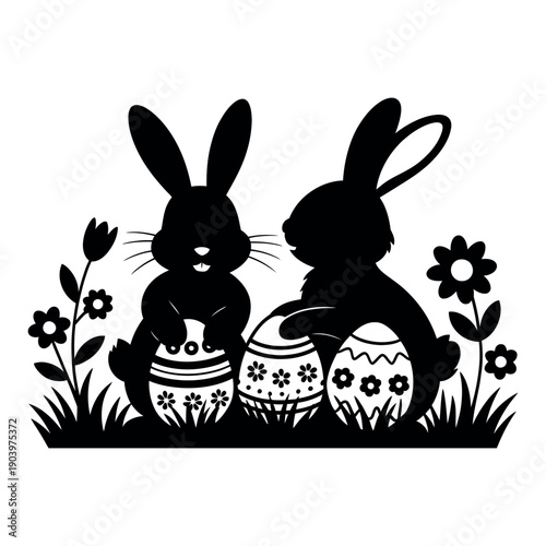 Two Easter bunnies sitting with decorated eggs in flowers