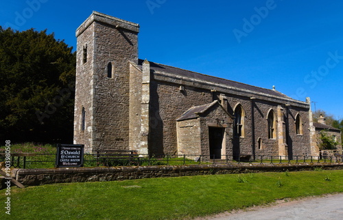 Stone church building with tower on a sunny day - Castle Bolton - England