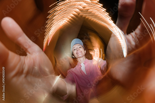 Creative motion portrait with swirling light trails and fisheye
