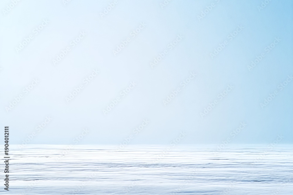 Fototapeta premium Gentle Snowfall in Arctic Landscape with Open Space and Soft Blue Sky