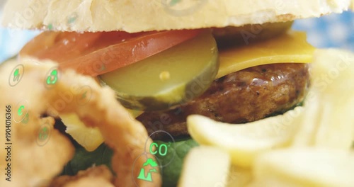 Eco icons appearing, starting onion ring moving into front, showing burger and fries