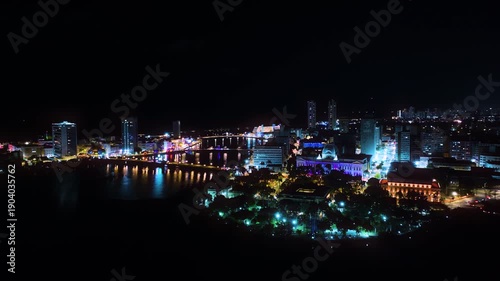 Wallpaper Mural Aerial night view of the city of Recife, Pernambuco, Brazil, highlighting the illuminated urban center and the Palácio do Campo das Princesas along the river.  Torontodigital.ca