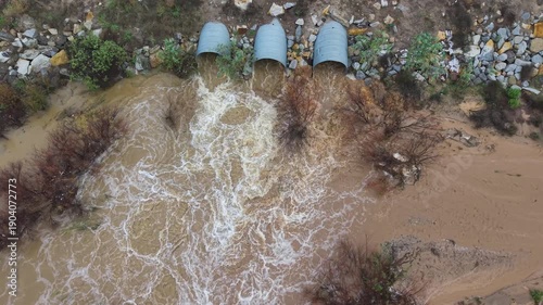 a creek with a water runoff after a heavy rain
