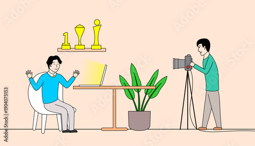 content creator sit at the table with a laptop n front off him