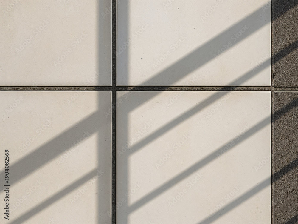 Fototapeta premium Close-up of white square tiles with diagonal shadows, creating a clean geometric background texture with minimalist style and modern design feel.