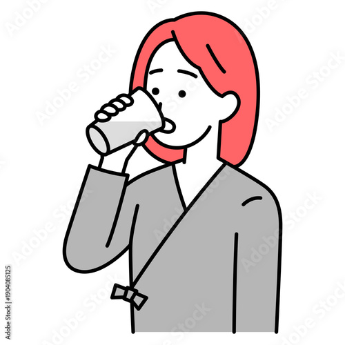 バリウムを飲む検査着の若い女性