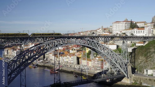 Wide shot of the metallic bridge spanning the Douro river valley.