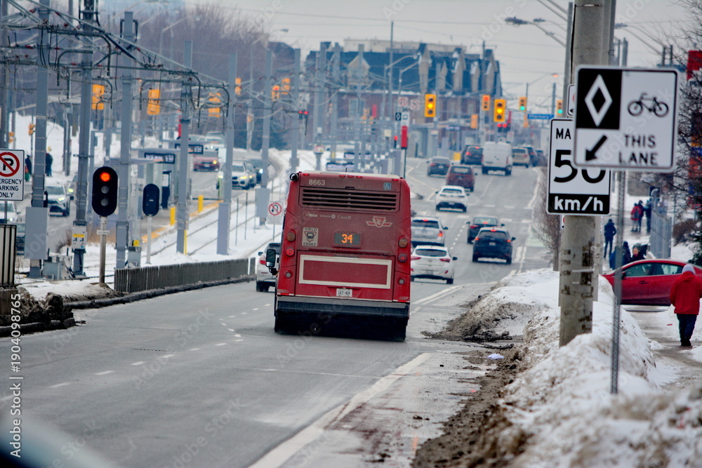 Fototapeta premium Toronto public transport TTC 34 Eglinton East Bus on Eglinton Avenue. Toronto, Ontario, Canada, February 6, 2026: Toronto public transport TTC 34 Eglinton East Bus makes its way along Eglinton Avenue 