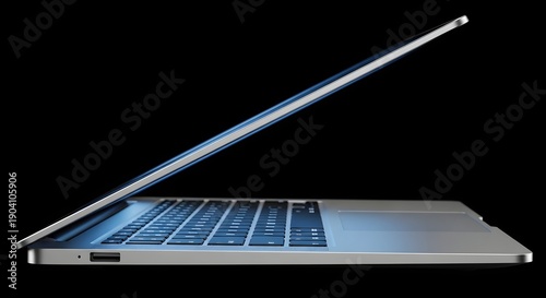 Laptop with screen open on a dark background viewed from the side