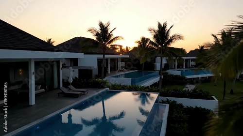 Wallpaper Mural Luxury Villa With Infinity Pool at Sunset Palm Trees and Tropical Ambiance. Torontodigital.ca