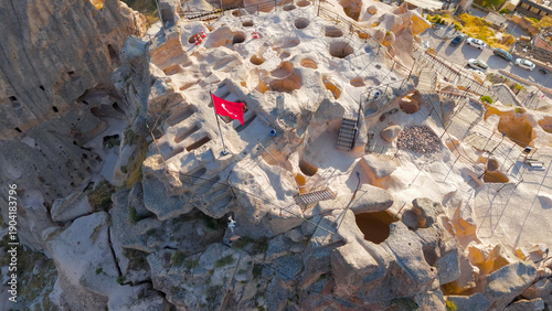 Wallpaper Mural Uchisar, Nevsehir, Turkey - July 13, 2025: Aerial view of massive Uchisar Castle rock fortress dominating Cappadocia landscape with surrounding village.. Aerial View Torontodigital.ca