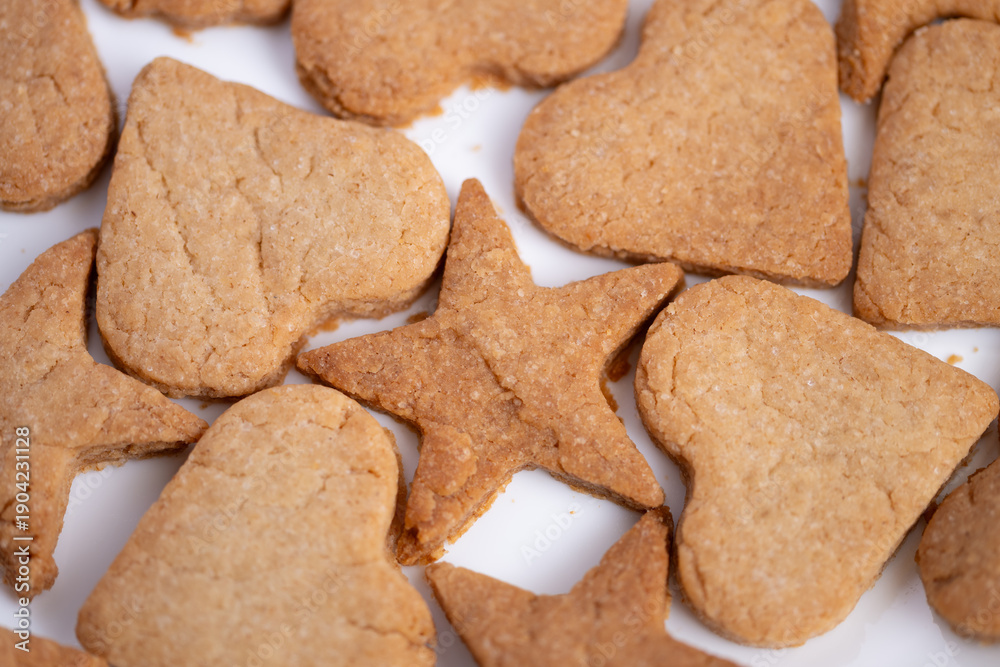 Heart and star treats arrangement, Flat arrangement of thematic cookies on neutral surface, Stylish presentation of heart and star shaped cookies with ample negative space