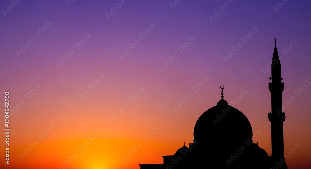 Fototapeta premium Silhouette of mosque dome and minaret against a vibrant purple and orange sunset sky