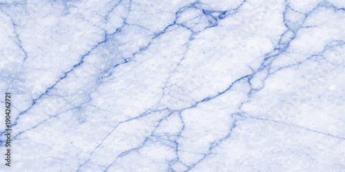 Abstract winter frost and ice texture background featuring white frozen patterns on a window against a cold blue sky with snowy clouds