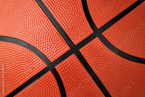 Macro shot rubber orange basketball ball with texture and black seams