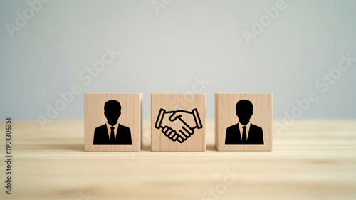 Business partnership handshake between two professionals