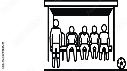 A soccer team is sitting on a bench in a dugout with a soccer ball on the ground.