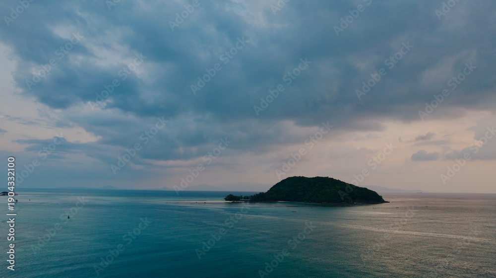 Obraz premium Peaceful Waters Beneath Colorful Dusk Clouds. Calm Turquoise Sea Under Dramatic Sky At Sunset Horizon