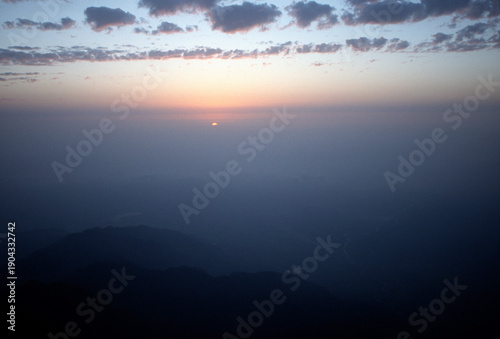 Sunrise on the Golden Summit of Mount Emei (Emei Shan) UNESCO World Heritage Site. Site of the first Buddhist temple in China. 3099 m. One of four sacred mountains in China.