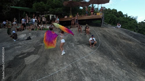 artist dancing at Party on the stones near the sea, fun and happy